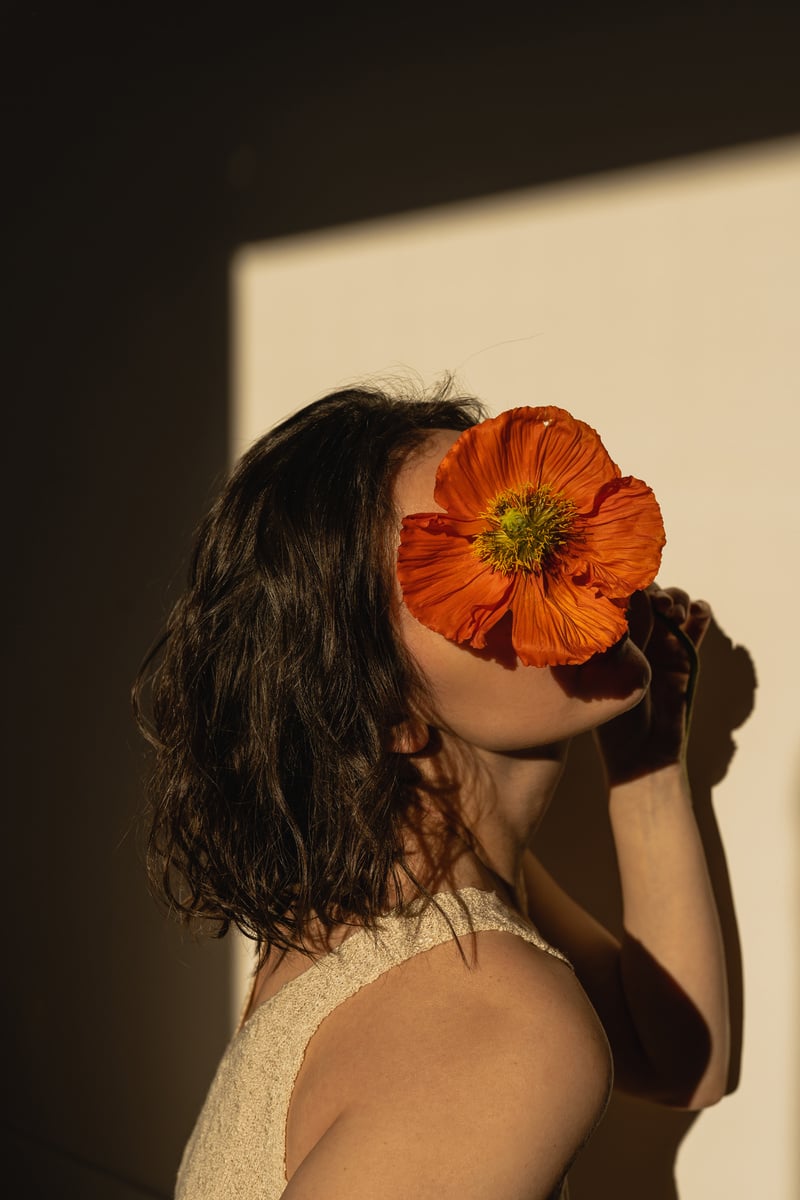 Woman with Poppy Flower on Her Face